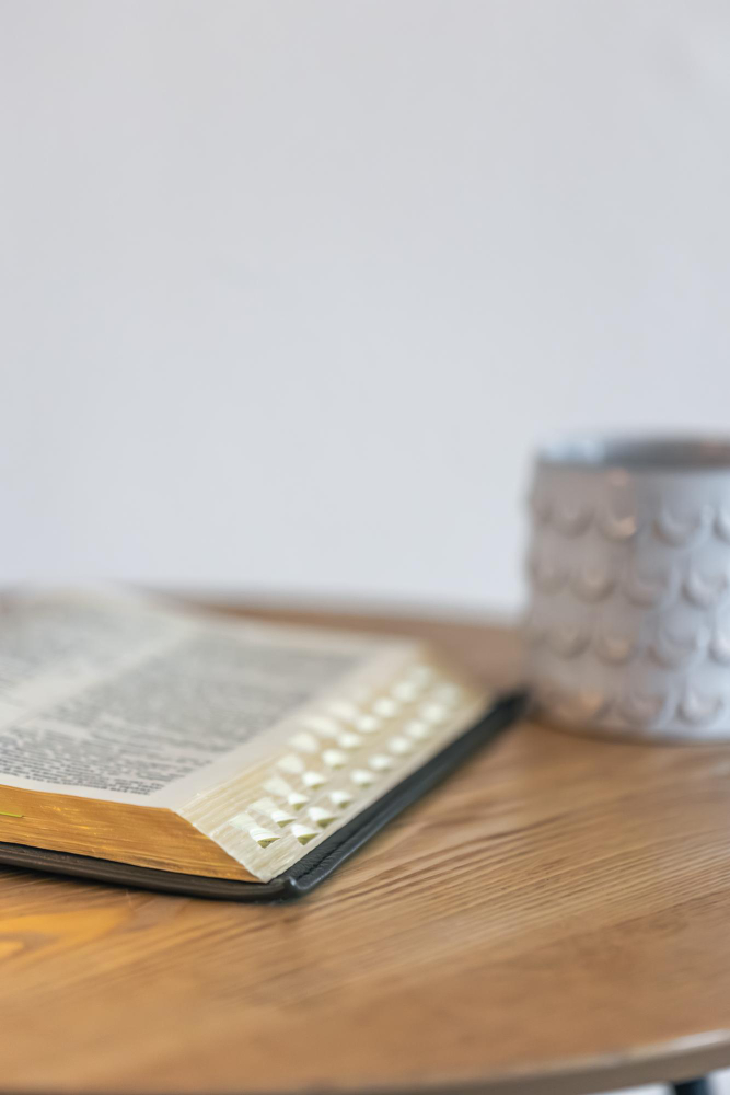 Open Bible and notebook on a desk